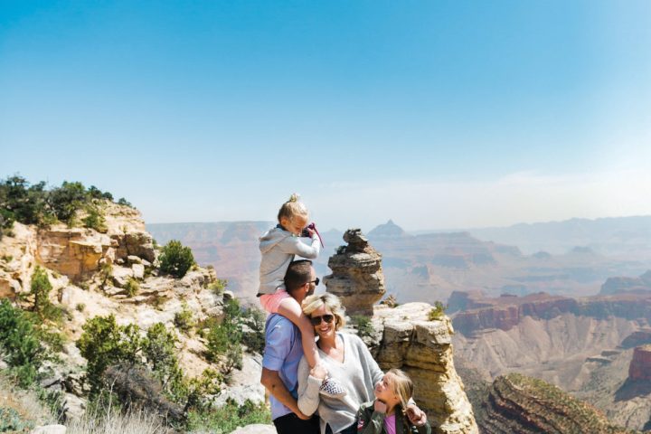 A family posing for a picture at the Grand Canyon private tour