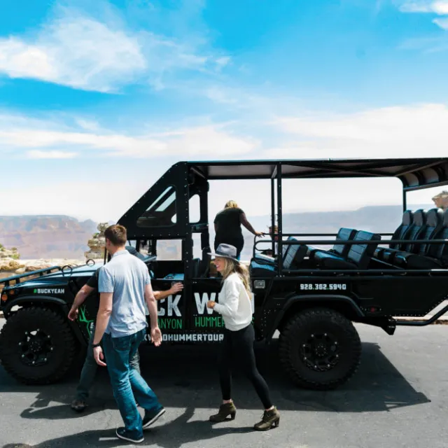 People exiting one of the custom Buck Wild hummers