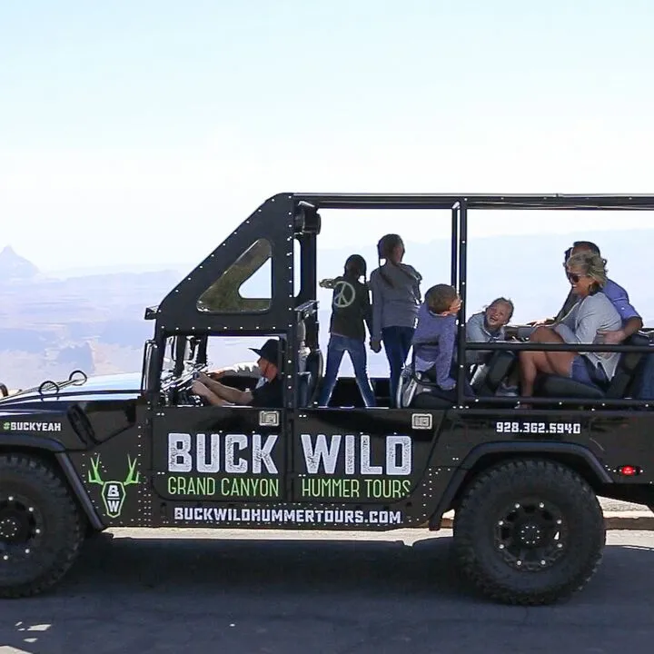 A family enjoying a ride on one of the custom Buck Wild hummers