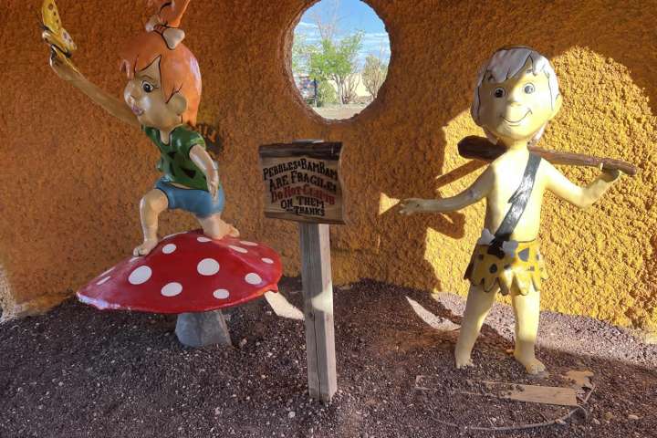 a group of stuffed animals sitting on top of a table