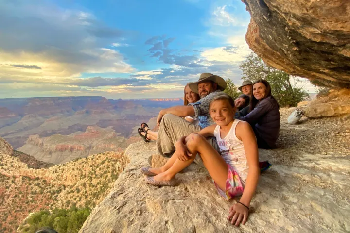 Valerie Cueto et al. standing in front of a large rock