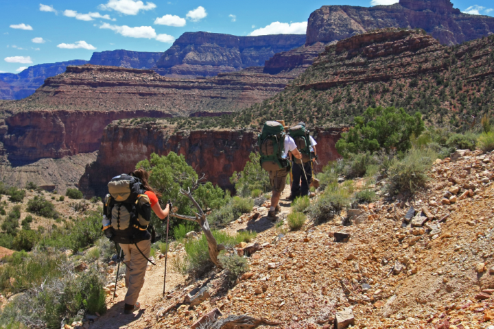 a man standing on a rocky hill