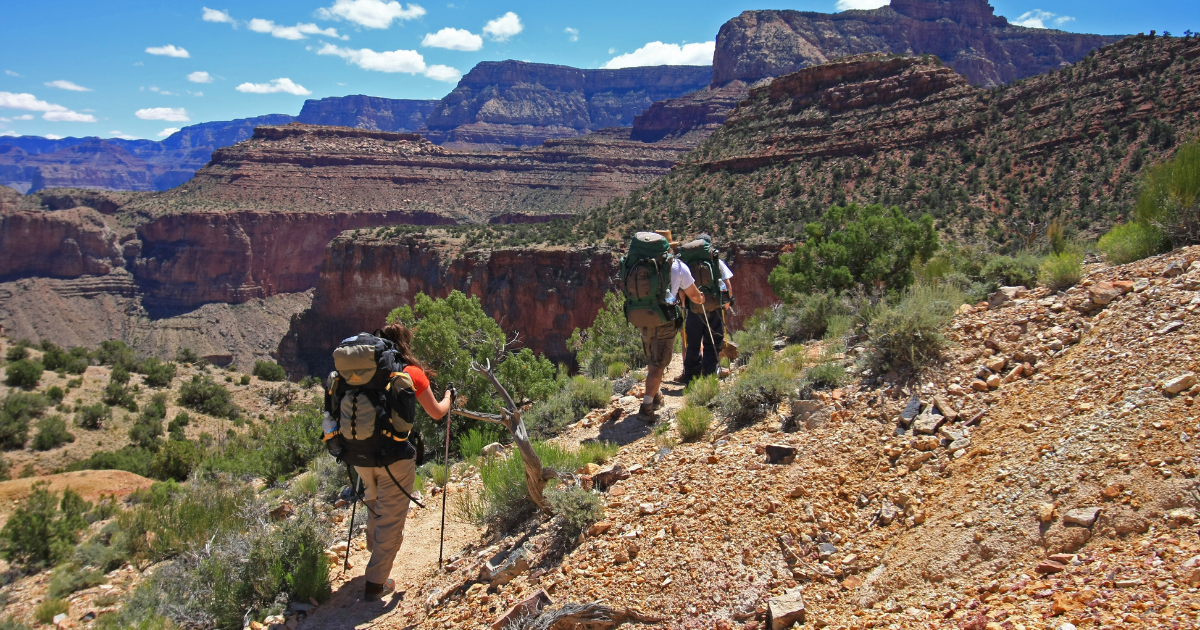 a man standing on a rocky hill
