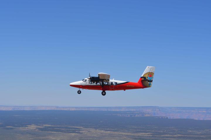 a large airplane flying high up in the air